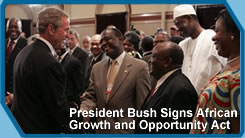 After signing into law the African Growth and Opportunity Act (AGOA) Acceleration Act of 2004, President George W. Bush meets with ceremony attendees in the Dwight D. Eisenhower Executive Office Building Tuesday, July 13, 2004. (White House Photo)